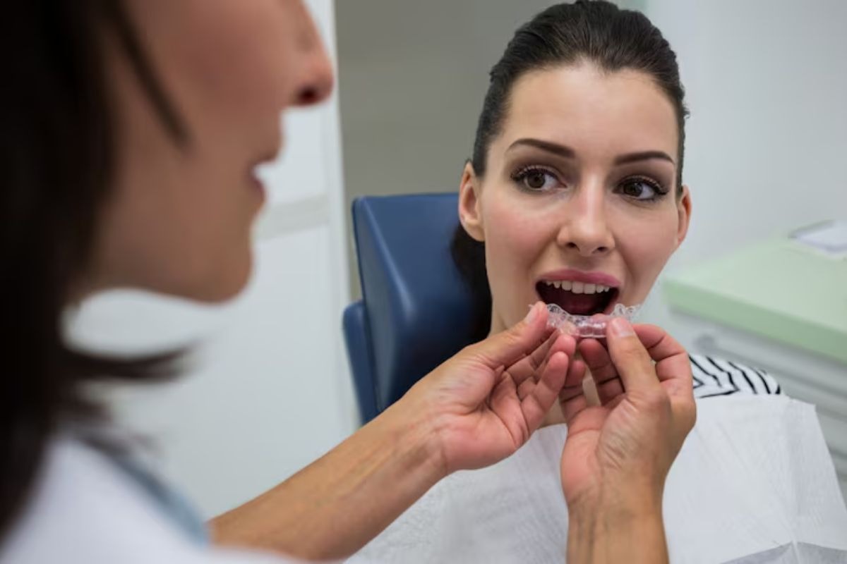 patient wearing invisalign clear aligners to correct common dental alignment issues.